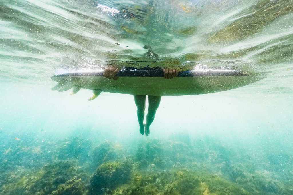 Underwater drone shot of surfer